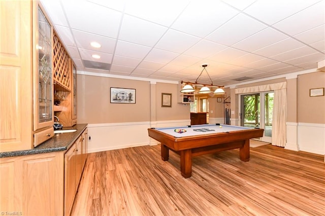 playroom with billiards, a sink, light wood-style floors, wainscoting, and a paneled ceiling