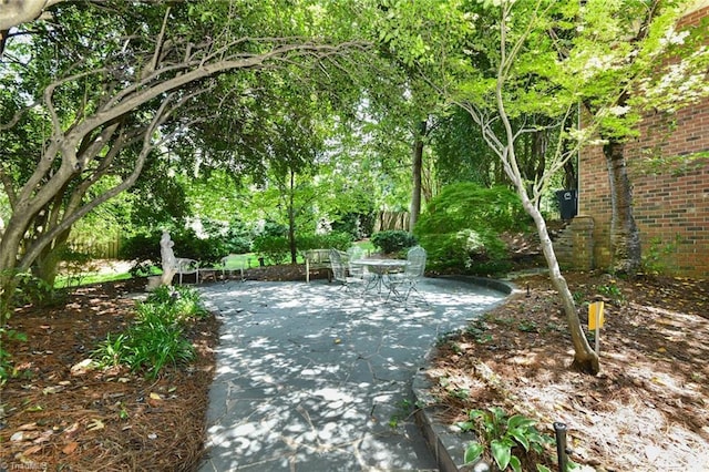 surrounding community featuring a patio