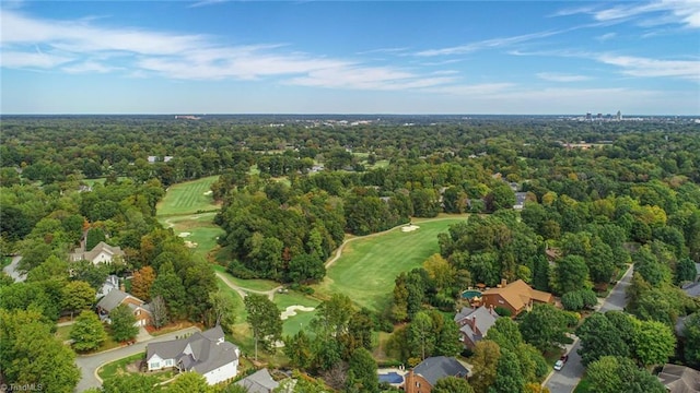 birds eye view of property featuring a view of trees and view of golf course