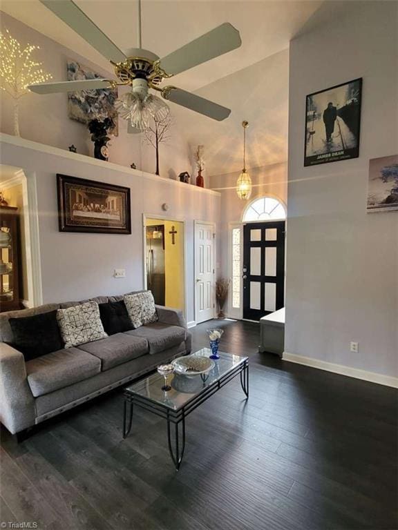 5125 Old Plantation Cir, Winston-Salem, NC 27104 - living room featuring a towering ceiling, ceiling fan, dark wood-style flooring, and baseboards