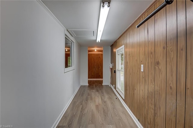 210 W Parkway Ave, High Point, NC 27284 - corridor featuring light wood-style floors, baseboards, and wood walls