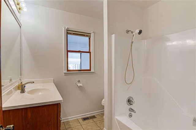 210 W Parkway Ave, High Point, NC 27284 - bathroom featuring vanity, washtub / shower combination, tile patterned floors, toilet, and baseboards