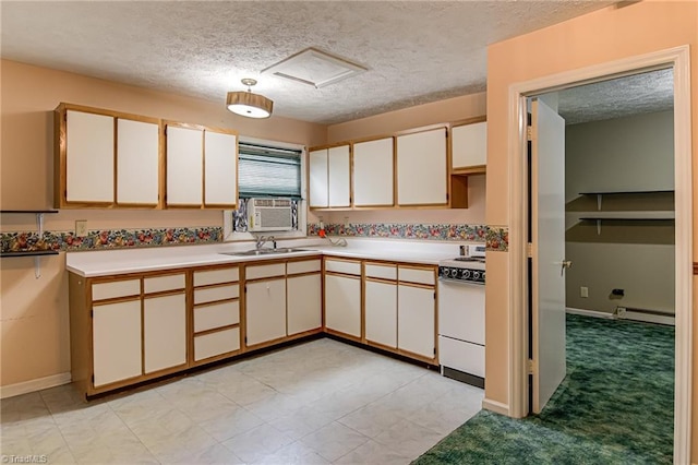 210 W Parkway Ave, High Point, NC 27284 - kitchen with white range oven, baseboard heating, a textured ceiling, light countertops, and a sink