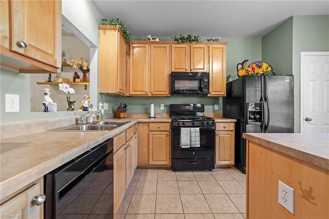 kitchen featuring light brown cabinetry, a sink, light countertops, light tile patterned floors, and black appliances
