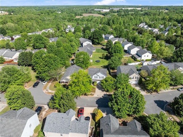 bird's eye view featuring a residential view and a forest view