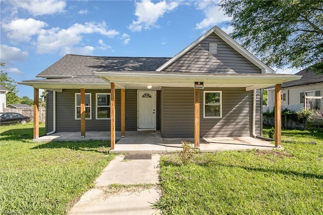 304 Ingram St, Thomasville, NC 27360 - view of front facade featuring a front yard and a shingled roof
