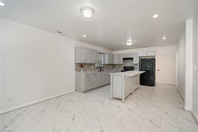 304 Ingram St, Thomasville, NC 27360 - kitchen with black appliances, light countertops, gray cabinets, light marble finish floors, and recessed lighting
