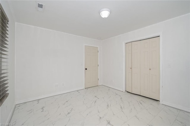 304 Ingram St, Thomasville, NC 27360 - unfurnished bedroom featuring light marble finish flooring and a closet