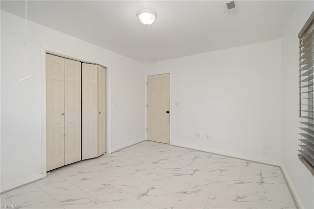 304 Ingram St, Thomasville, NC 27360 - unfurnished bedroom with light marble finish flooring and a closet