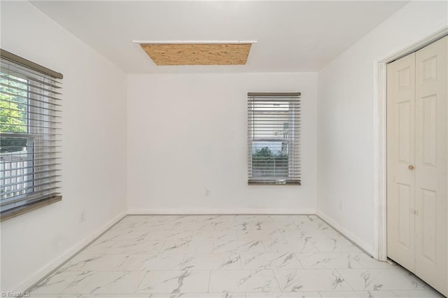 304 Ingram St, Thomasville, NC 27360 - unfurnished bedroom with light marble finish floors and a closet