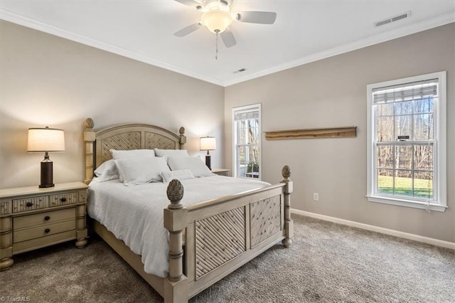 bedroom featuring visible vents, crown molding, baseboards, carpet, and a ceiling fan