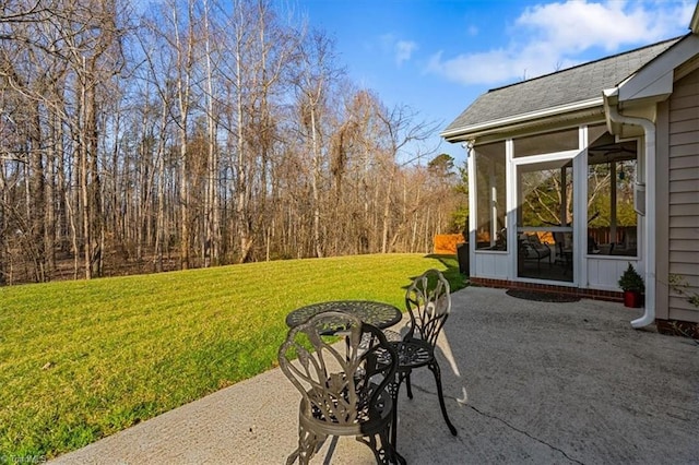 view of patio featuring a sunroom