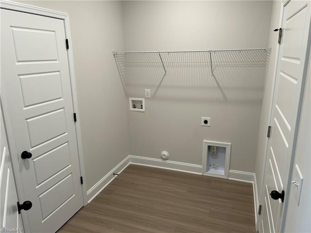 washroom with gas dryer hookup, hookup for a washing machine, electric dryer hookup, and hardwood / wood-style flooring