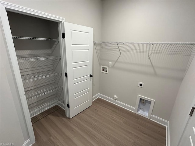 laundry area with electric dryer hookup, hookup for a washing machine, hookup for a gas dryer, and wood-type flooring