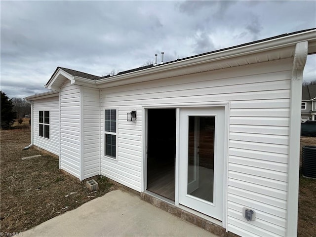 rear view of house featuring central air condition unit