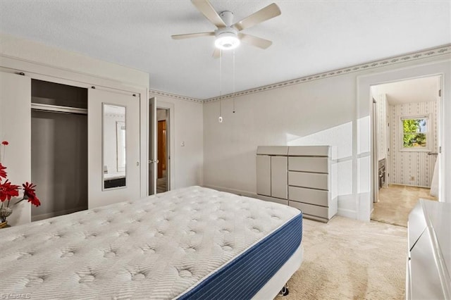 carpeted bedroom with a ceiling fan