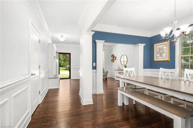 301 Summerwalk Rd, Greensboro, NC 27455 - dining room with decorative columns, crown molding, a decorative wall, a wainscoted wall, and dark wood-style flooring