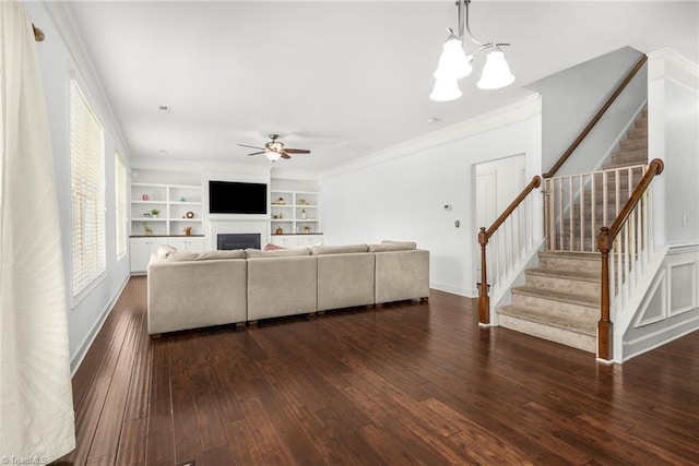 301 Summerwalk Rd, Greensboro, NC 27455 - living area featuring a ceiling fan, stairway, dark wood-style flooring, crown molding, and a fireplace