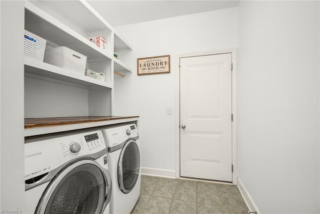 301 Summerwalk Rd, Greensboro, NC 27455 - washroom featuring washing machine and clothes dryer and light tile patterned flooring