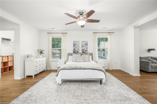 301 Summerwalk Rd, Greensboro, NC 27455 - bedroom with multiple windows, wood finished floors, and a ceiling fan
