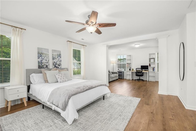 301 Summerwalk Rd, Greensboro, NC 27455 - bedroom with an office area, wood finished floors, and a ceiling fan