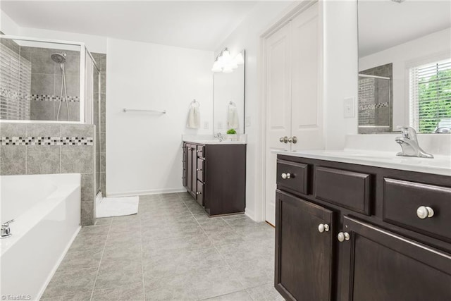 301 Summerwalk Rd, Greensboro, NC 27455 - bathroom featuring a shower stall, two vanities, a garden tub, and tile patterned floors