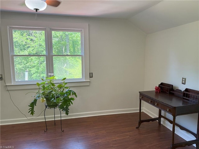office featuring baseboards, wood finished floors, healthy amount of natural light, vaulted ceiling, and a ceiling fan