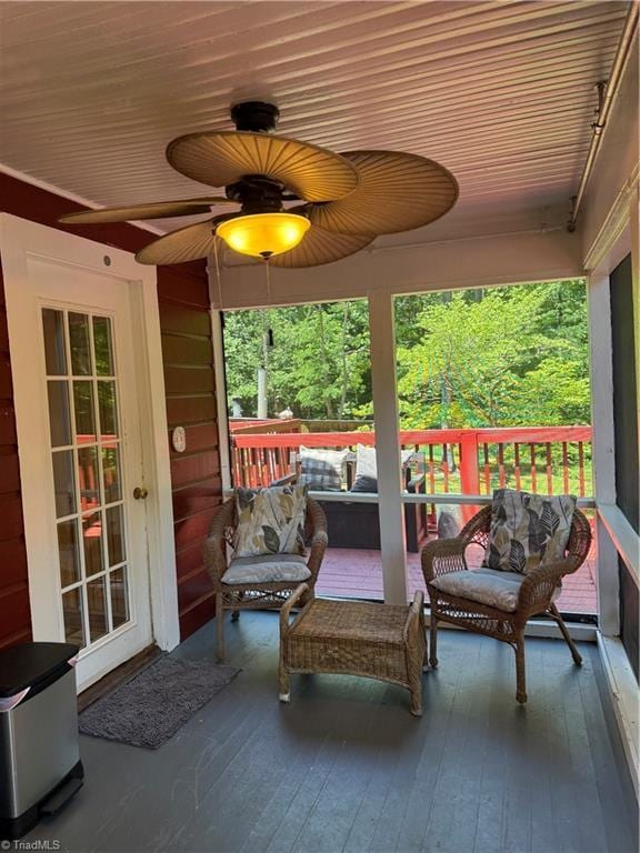 deck featuring an outdoor living space and ceiling fan
