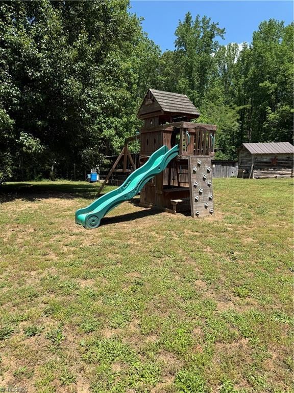 view of play area featuring a lawn