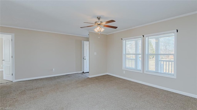 carpeted empty room with crown molding and ceiling fan