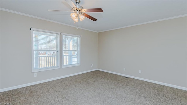 unfurnished room with crown molding, carpet flooring, and ceiling fan