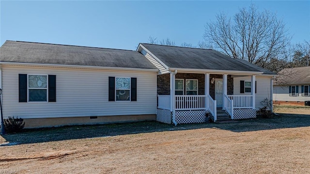 view of front of property with covered porch and a front yard