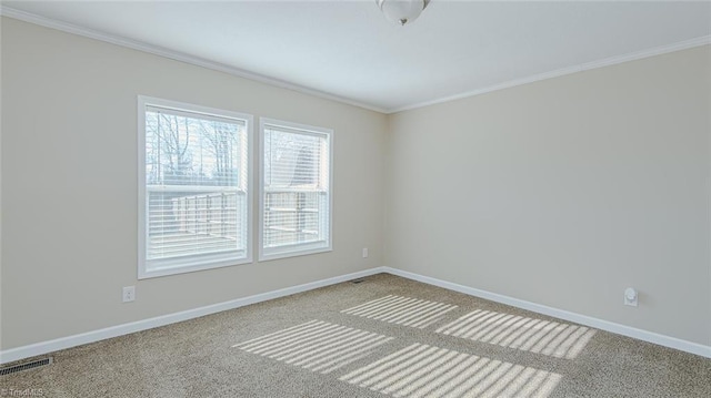 carpeted empty room with ornamental molding