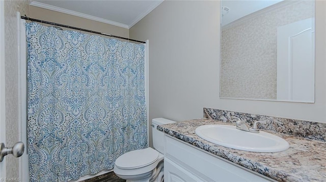 bathroom with ornamental molding, toilet, and vanity