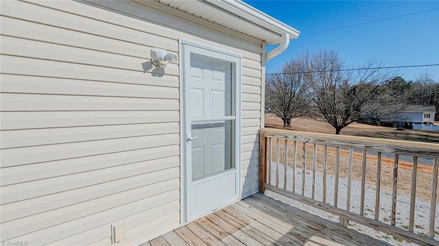 property entrance with a wooden deck