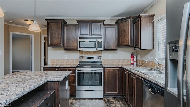 kitchen with sink, decorative light fixtures, ornamental molding, dark hardwood / wood-style floors, and appliances with stainless steel finishes