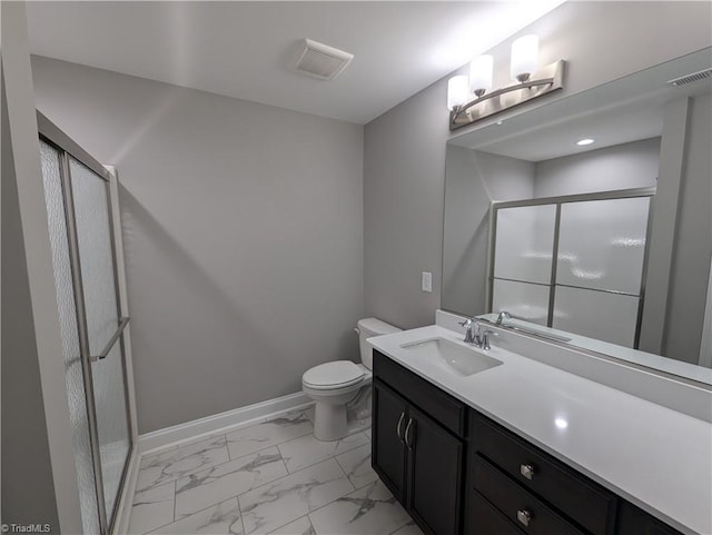 bathroom with toilet, a shower with shower door, and vanity