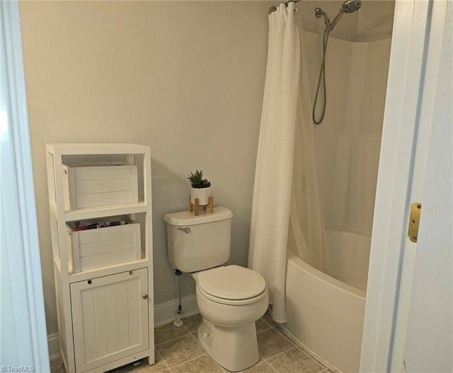 bathroom featuring tile patterned floors, shower / tub combo, and toilet