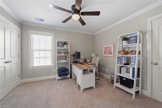 office area featuring visible vents, baseboards, light colored carpet, and crown molding