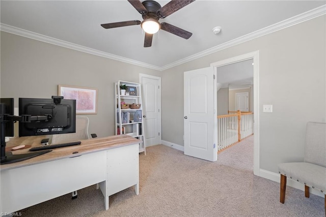 office area with light carpet, baseboards, and ornamental molding