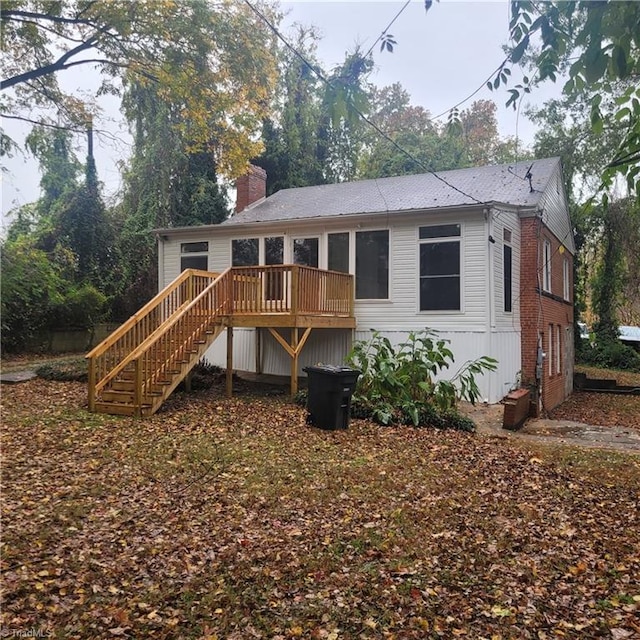 back of property with a deck