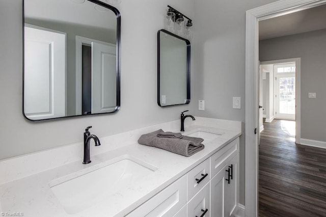 112 Emerald Ct, Trinity, NC 27370 - bathroom featuring double vanity, wood finished floors, and baseboards