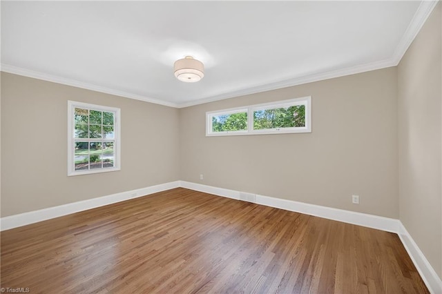 506 Audubon Dr, Greensboro, NC 27410 - spare room with plenty of natural light, wood finished floors, and ornamental molding