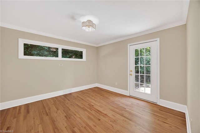 506 Audubon Dr, Greensboro, NC 27410 - spare room featuring light wood-style floors and crown molding