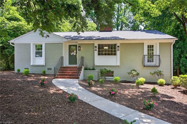 506 Audubon Dr, Greensboro, NC 27410 - view of front of home with brick siding and a chimney