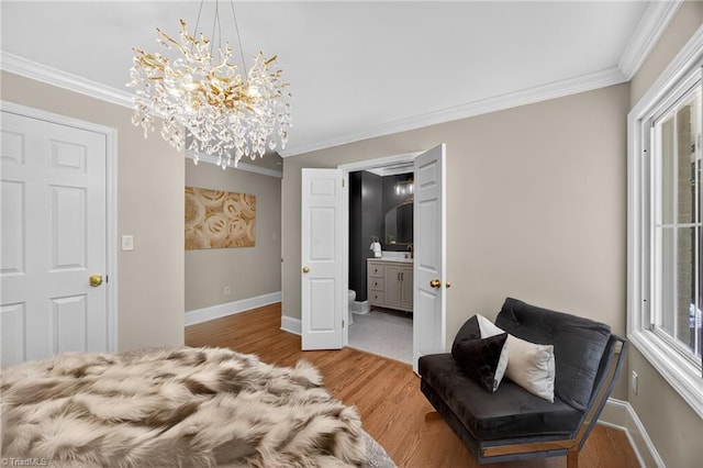 506 Audubon Dr, Greensboro, NC 27410 - bedroom with ornamental molding, wood finished floors, and a chandelier