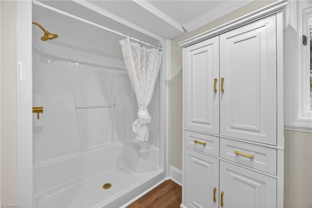 506 Audubon Dr, Greensboro, NC 27410 - full bathroom with curtained shower, wood finished floors, and crown molding