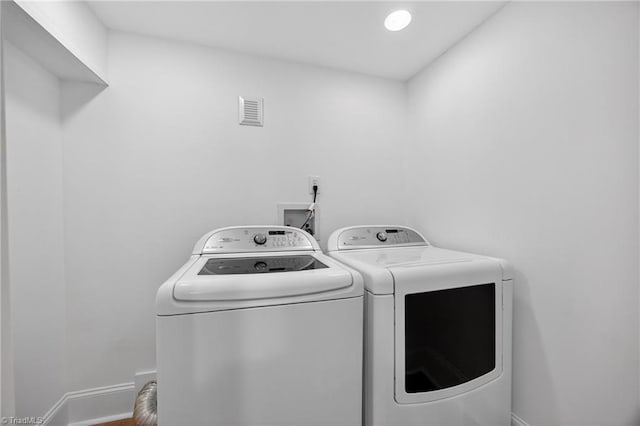 506 Audubon Dr, Greensboro, NC 27410 - laundry room featuring washing machine and dryer and baseboards