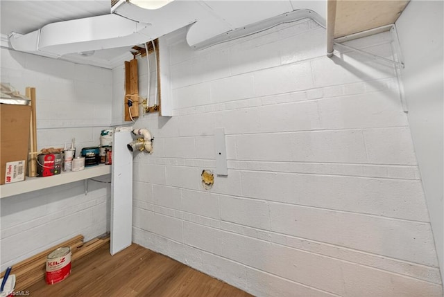 506 Audubon Dr, Greensboro, NC 27410 - unfinished below grade area featuring wood finished floors and concrete block wall