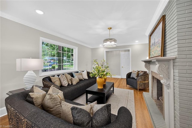 506 Audubon Dr, Greensboro, NC 27410 - living area with wood finished floors, ornamental molding, a fireplace, a chandelier, and recessed lighting
